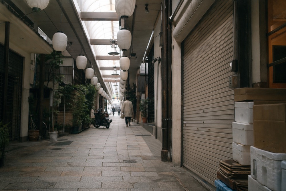 A covered shopping arcade near Kintetsu Nara Station with lanterns hanging above the walkway