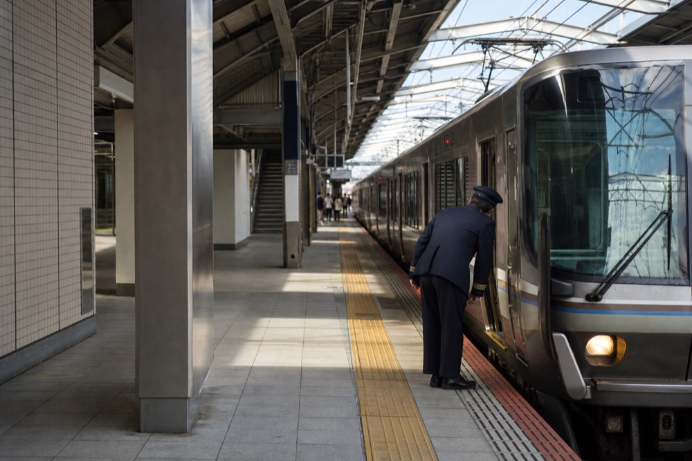 A platform sign at JR Nara Station showing the next Miyakoji Rapid departure