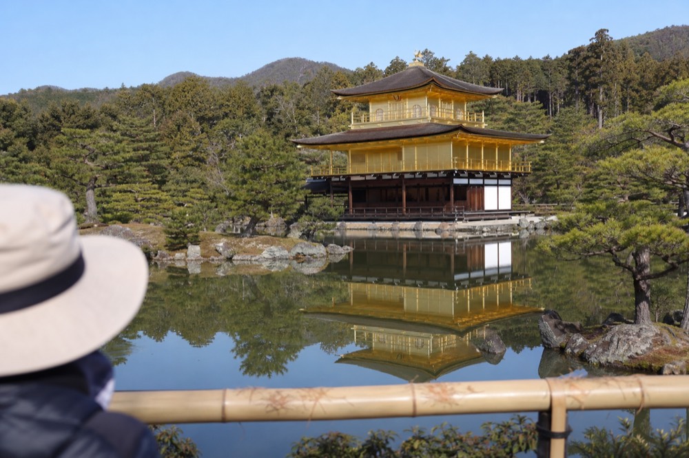 The golden pavilion seen across the pond from the classic viewing spot