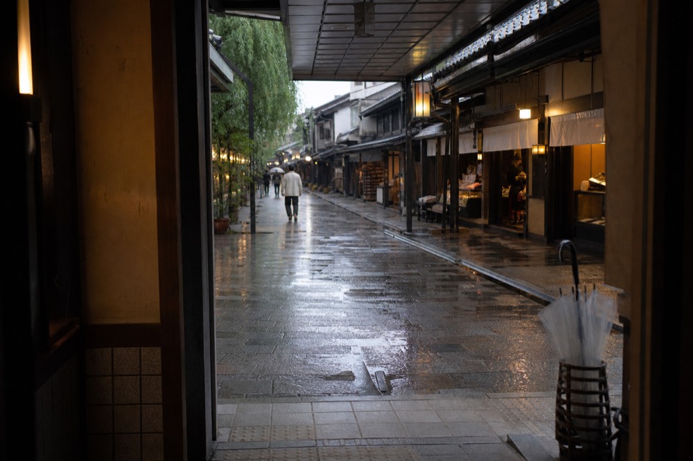 A covered shopping arcade with small food shops on both sides